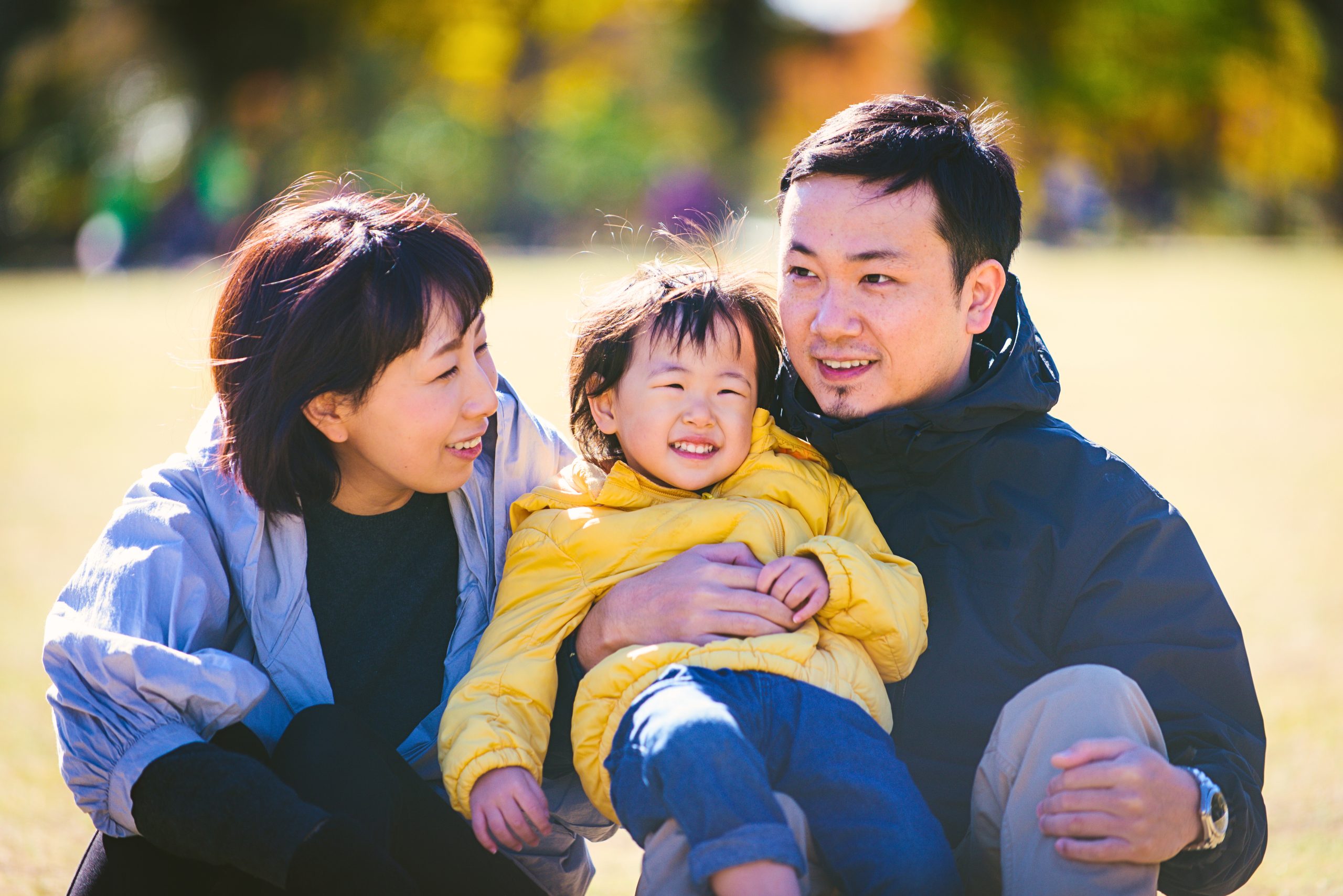 A happy family with mother, father and child of Chinese ethnicity
